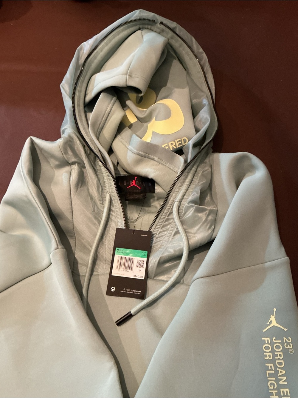 Jordan Men's Light Sage Green Pullover Hoodie with Pale Yellow Logo